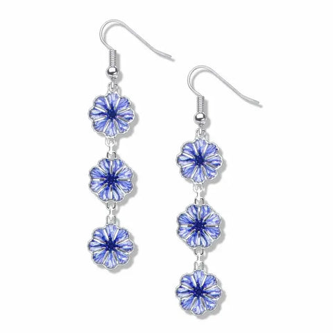 Silver cornflower earrings that are made to dangle down from the ear. They are blue, and each pair has three small flowers that fall in a line.