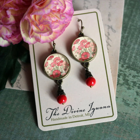 Lightweight earrings have an antiqued bronze finish for a warm, heirloom appearance with lovingly handmade reversed decoupage glass cabochons in elegant base metal findings.