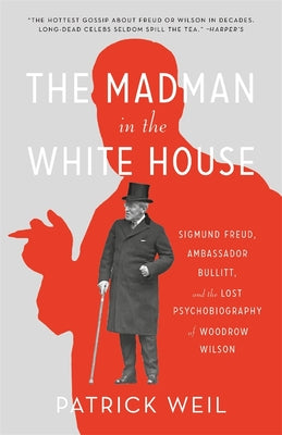 The cover shows a silhouette of a man in red and a black and white image of Woodrow Wilson in the center of the page. 