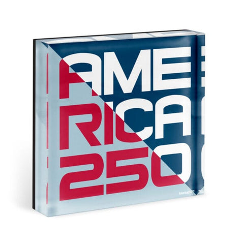 An acrylic magnet that says America 250. The color scheme is split in half, with one side being blue and white and the other side being light blue and red.