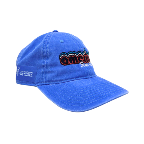 Light blue hat with retro style embroidery on the front. It reads American since 1176. On the side is a patch with a logo for the National WWI Museum and Memorial.