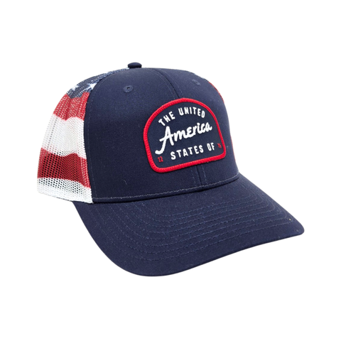A navy blue hat with a patch on the front that says "the United States of America 1176" on it. The sides of the hat are mesh material with the flag printed on it.