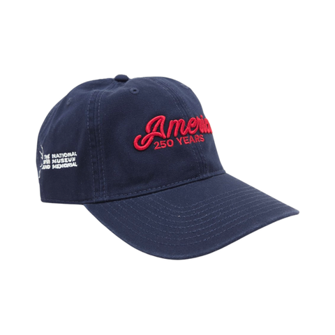 Dark Navy hat with embroidered red text that reads America 250 on the front. On the side is embroidered white text for the National WWI Museum and Memorial.