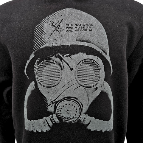 A close up image of a gray illustration of a WWI American Doughboy wearing a gasmask. On the soldiers helmet is the logo for the National WWI Museum and Memorial. The illustration is printed on black fabric.