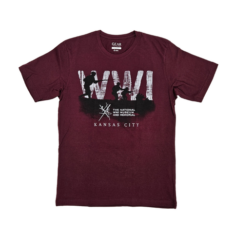 Maroon t-shirt featuring a black and white design of soldiers running over the horizon. Faded in the background is the text WWI. Underneath the soldiers is the Intersection logo for the National WWI Museum and Memorial, with Kansas City written underneath it. 