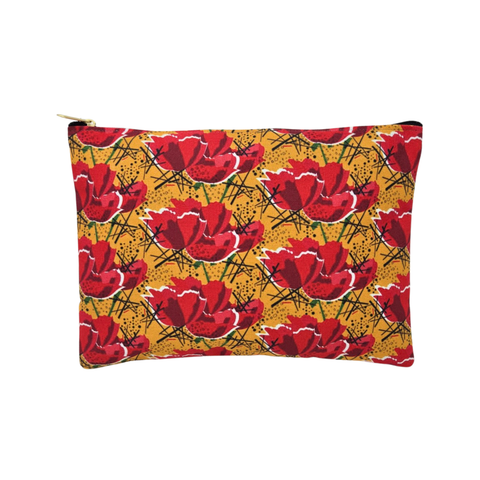 A large rectangular pouch with a bold red poppy pattern on a mustard yellow background, featuring a zipper closure. 