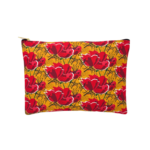 A small rectangular pouch with a bold red poppy pattern on a mustard yellow background, featuring a zipper closure. 