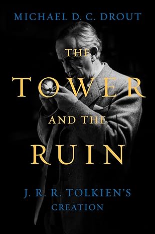 The book cover is dark with a black and white photograph of J.R.R. Tolkien lighting a pipe. The book title is imposed over the image in a pale yellow. 
