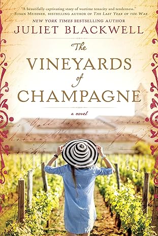 Book cover featuring a woman in a striped wide-brimmed hat and blue shirt standing in a vineyard, facing away toward rows of grapevines. The title is centered in elegant lettering above her, with decorative scrollwork framing the edges.