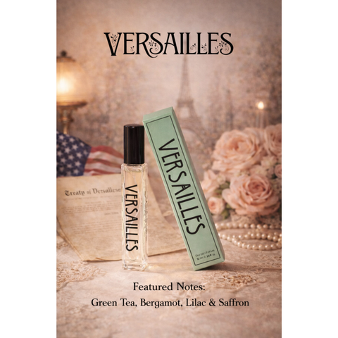 A display for a perfume bottle with soft images of roses, the American flag, and the Eifel Tower in the background. In the foreground is the perfume itself, with bold text running down the side for the name "Versailles".