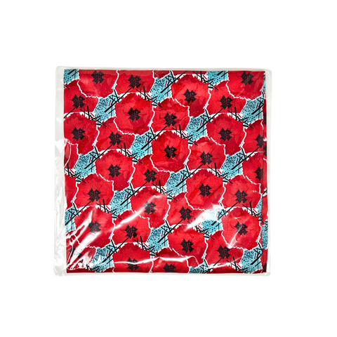 This image depicts a silk scarf with digitally manipulated poppies that are repeated and stacked on one another with the National WWI Museum and Memorial Intersections logo interlaced between. The pocket scarf has a color theme of red poppies, with light blue accents. It folded into quarters and placed inside of clear plastic packaging that it comes in, and placed on a white back drop.